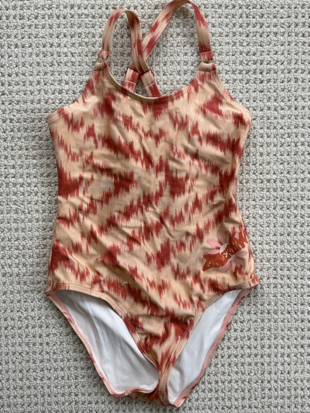 Zimmermann Kids One-Piece Swimsuit in Peach and Rust.